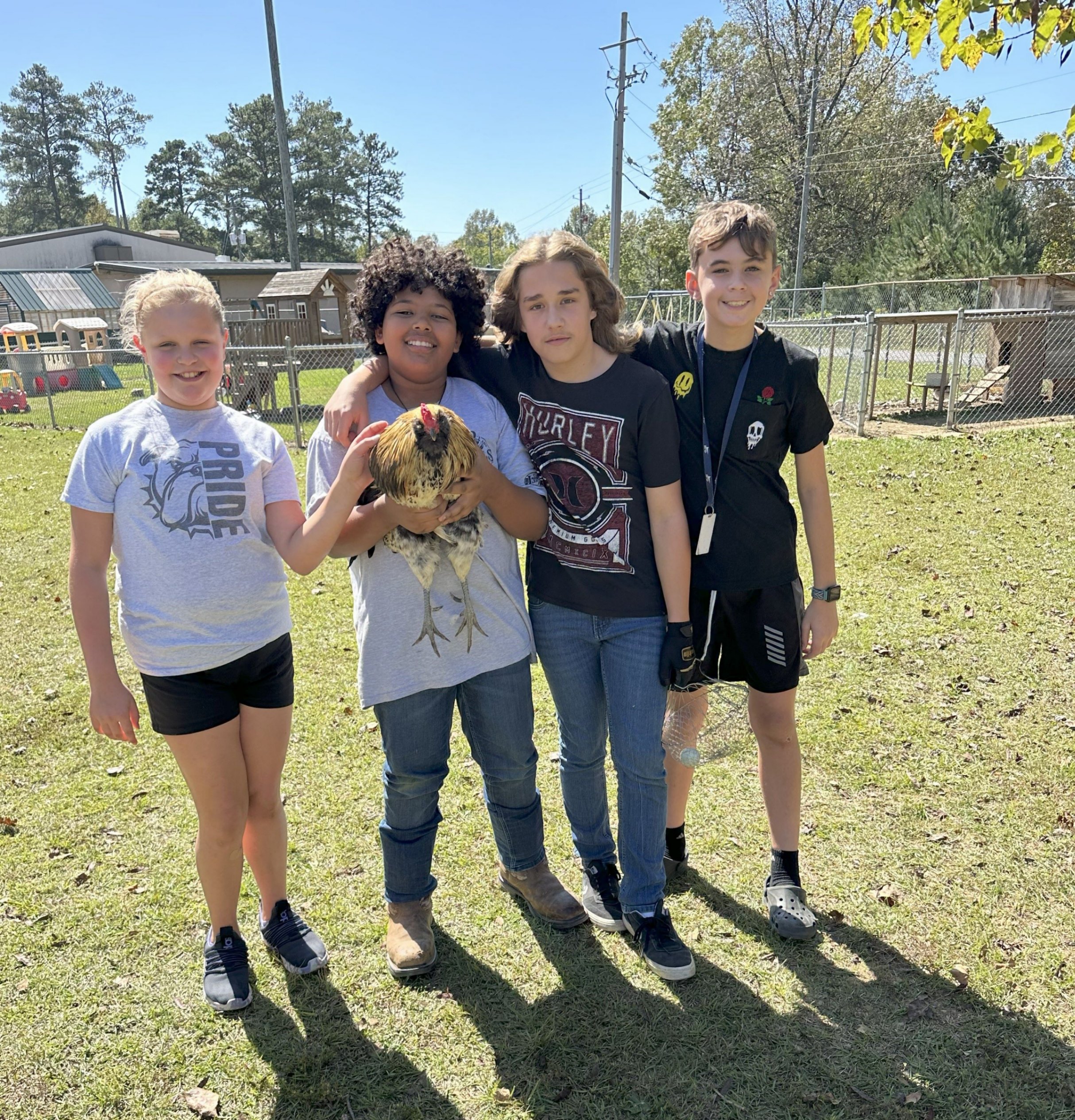 Students Caring for and Holding Chicken